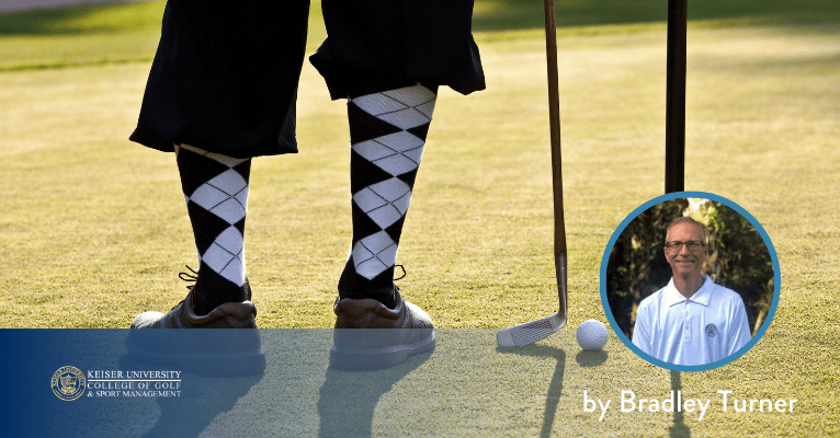 Golfer in argyle socks with vintage putters preparing to putt on a sunny green.
