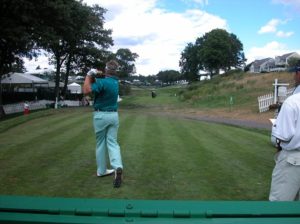 Male Golfer Teeing Off