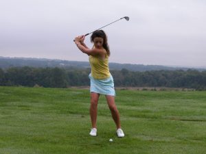 Woman Golfer in Her Backswing