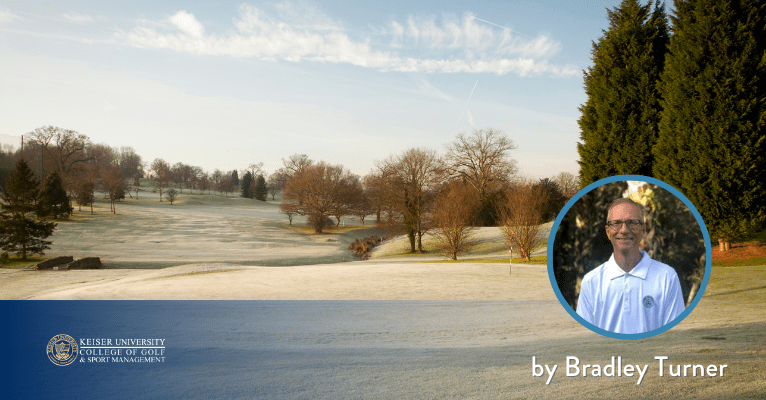 Frosty golf course landscape at sunrise with bare trees, showing cold-weather playing conditions.