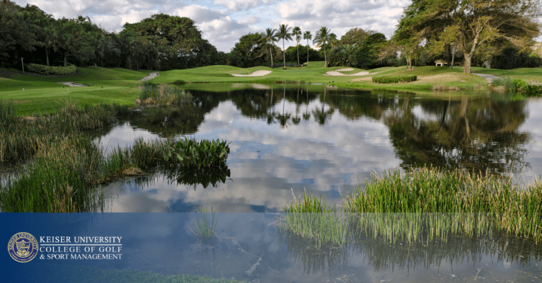 Scenic golf course with water hazard and sand bunkers, representing careers in golf management and marketing