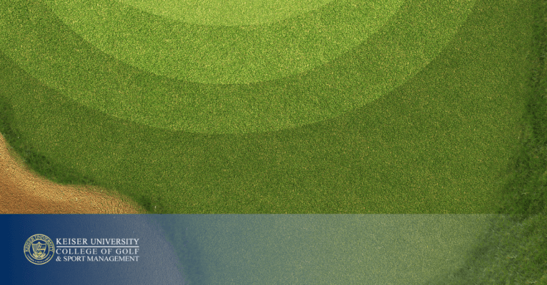 Aerial view of a golf green with a sand bunker and Keiser University College of Golf logo.