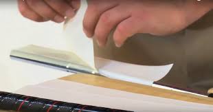 Image showing how to apply double-sided grip tape. 