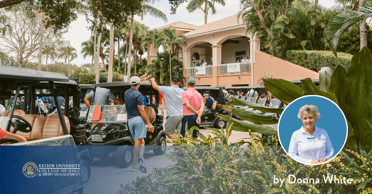 Golfers preparing near carts outside clubhouse at Keiser University College of Golf during a group event.