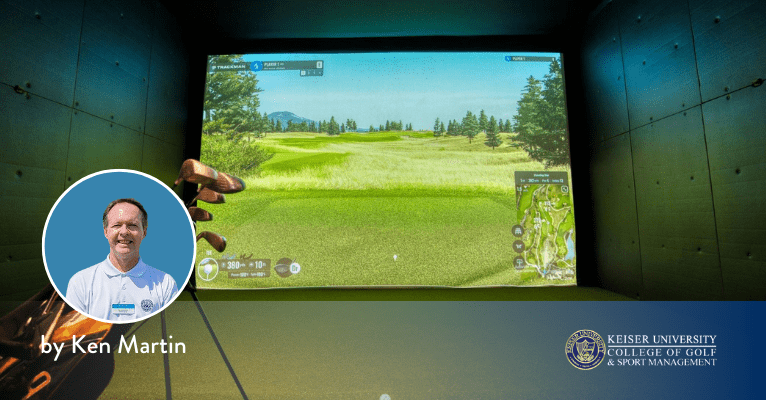 Golf simulator showing a virtual course with clubs in front, used for indoor practice.