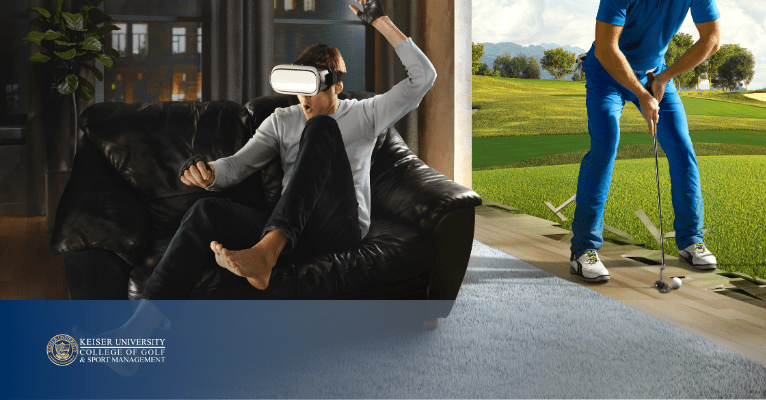 Man on couch using VR headset for golf training while golfer swings on simulated course in blended virtual environment.